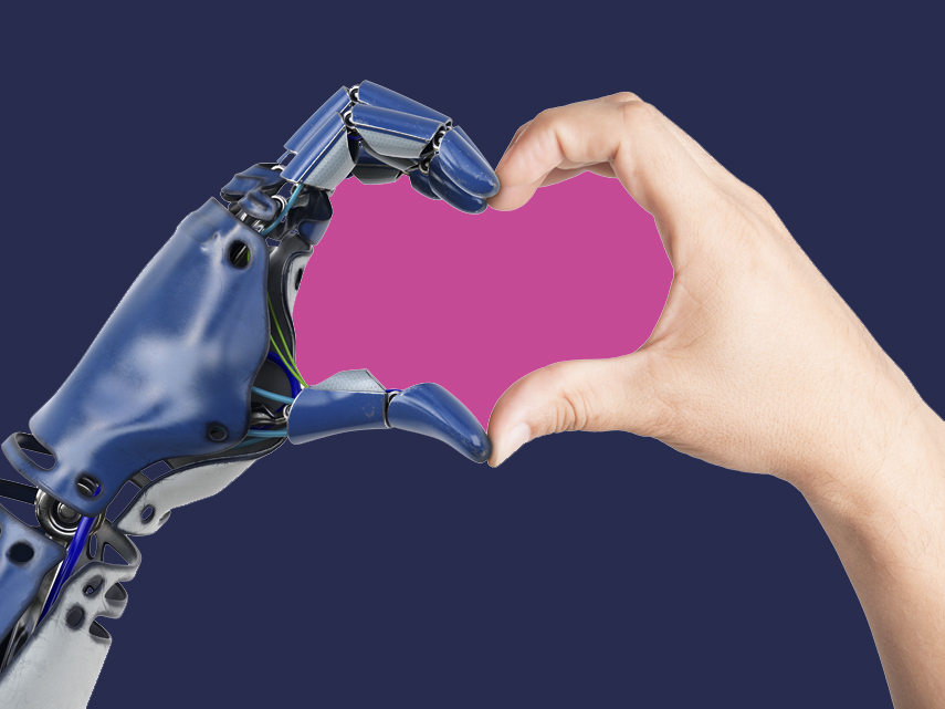 En robotarm och en mänsklig arm formar ett hjärta med händerna