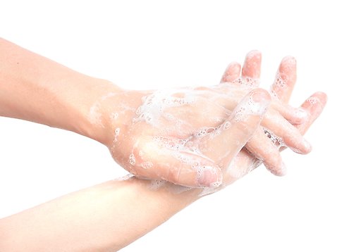 Händer som tvättas i tvål.